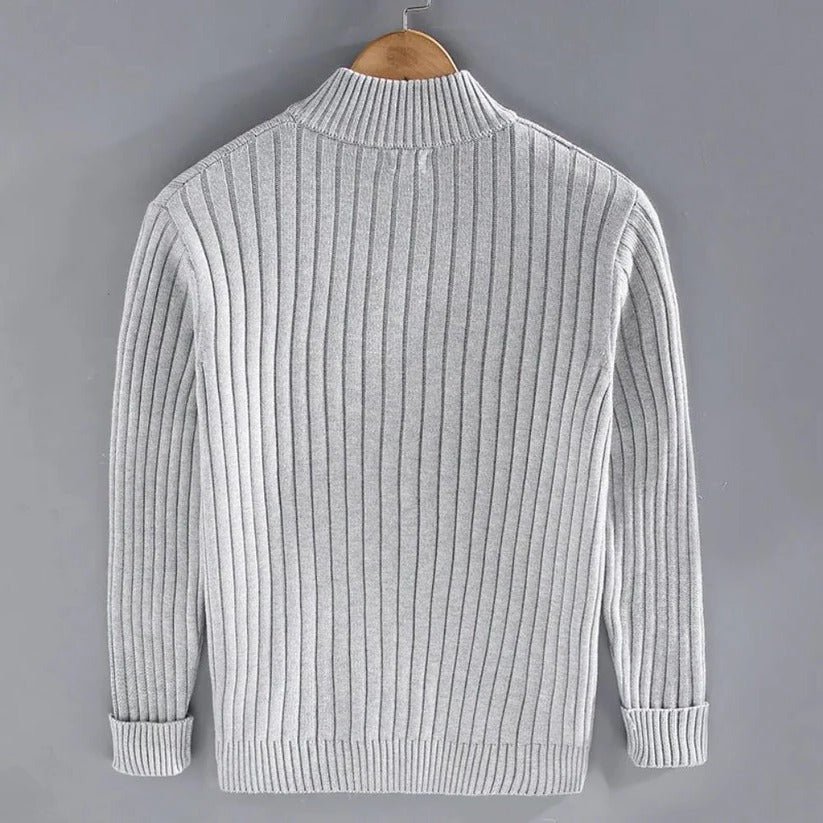 Close up of the ribbed cuffs and front zipper hardware on the cardigan